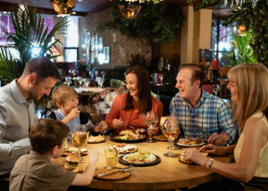 A family eating dinner together at a restaurant